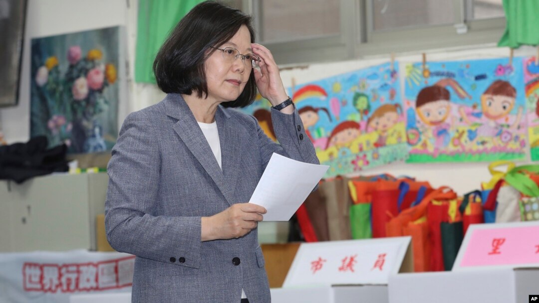 Taiwanese President Tsai Ing-wen waits to cast her ballot at a polling station, Saturday, Nov. 24, 2018, in Taipei, Taiwan. 