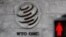 FILE - A logo is pictured outside the World Trade Organization (WTO) headquarters next to a red pedestrian traffic light, in Geneva, Switzerland, Oct. 2, 2018.