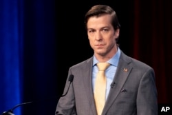 FILE - Libertarian presidential candidate Chase Oliver photographed during a debate in Atlanta, Georgia, Oct. 16, 2022.