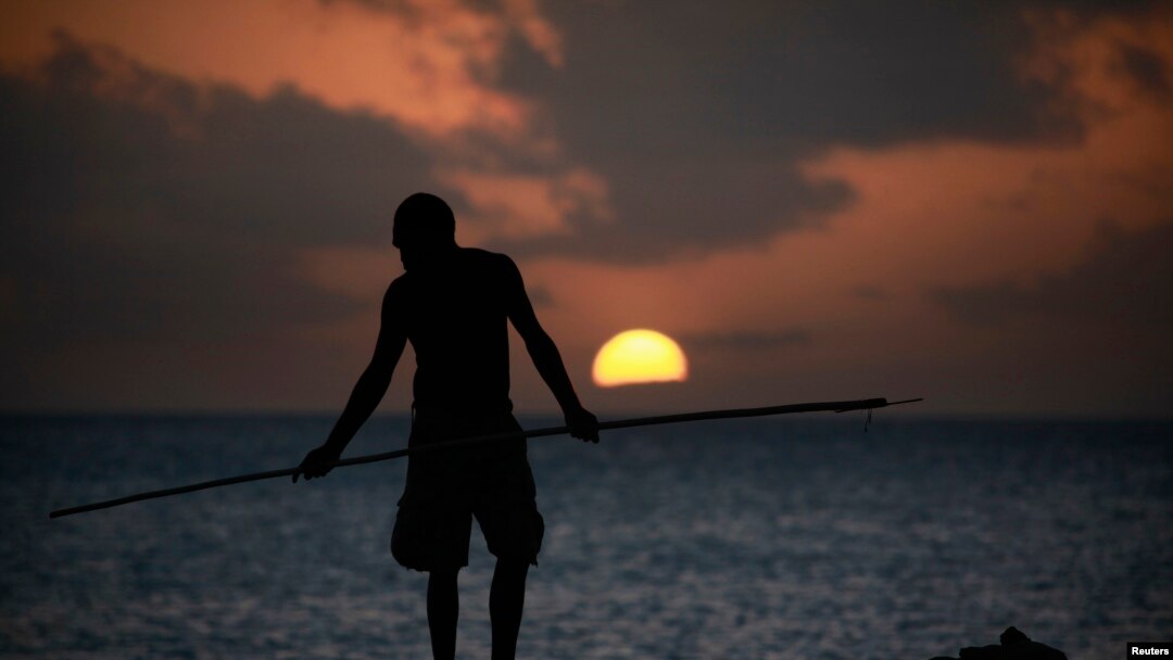 FILE - An Aboriginee is seen spear fishing in Australia's Northern Territory.