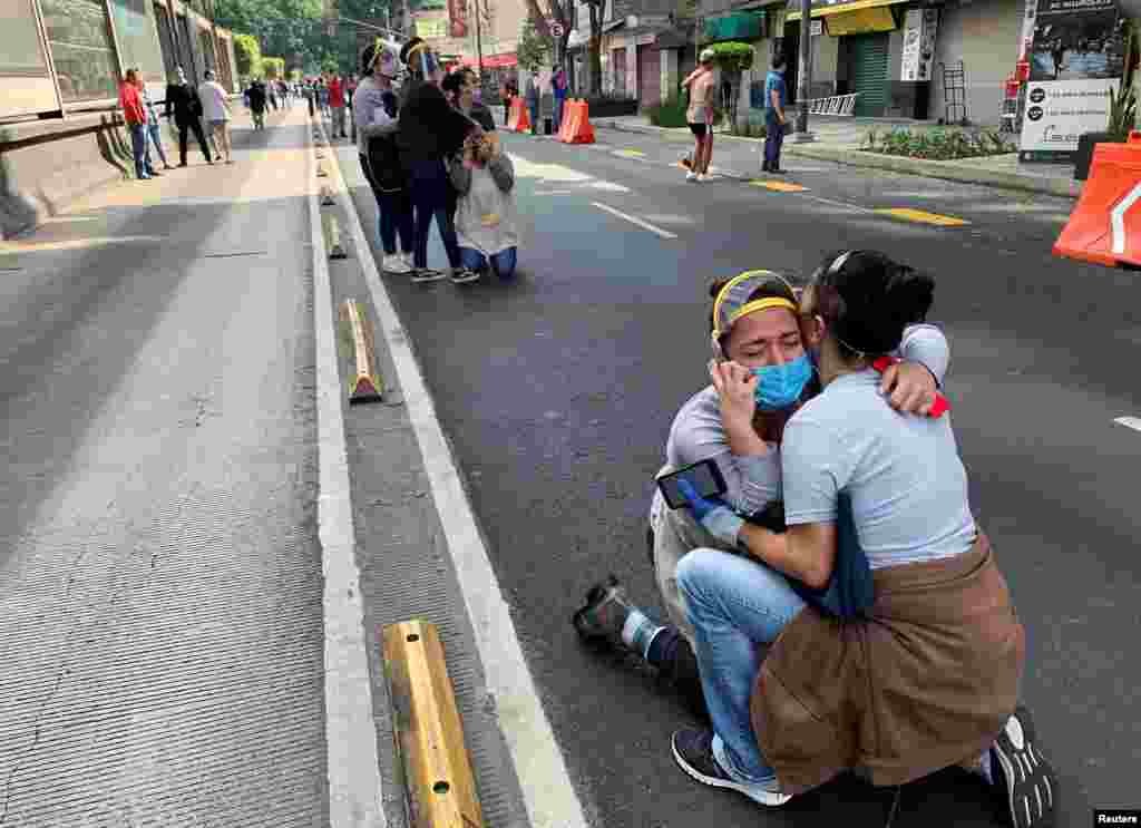 People react during an earthquake in Mexico City, Mexico.