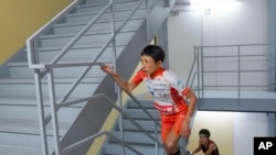 FILE - In this photo provided by ISF/Meeting, runner Yuri Yoshizumi competes during a race of Stairclimbing World Championships in Osaka, western Japan, on Nov. 19, 2023. (ISF/MEETING via AP)