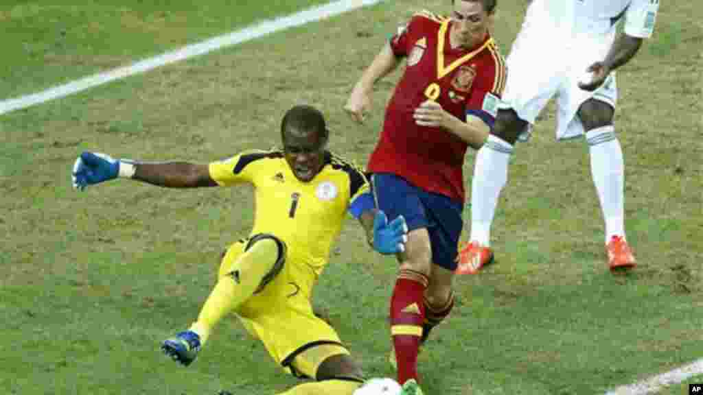 Nigeria goalkeeper Vincent Enyeama, left, challenges Spain's Fernando Torres.