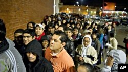 Hundreds of early-morning shoppers get in line the night before hoping to snag a deal on Black Friday at Best Buy in Atlanta, 26 Nov 2010