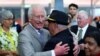 Britain's King Charles embraces Uncle James 'Michael' Widdy Welsh, a member of the Indigenous community, during a visit to the National Centre of Indigenous Excellence in Sydney, Australia, October 22, 2024.