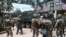FILE - In this May 30, 2017 photo, Philippines government troops prepare to head to the frontline as fighting with Muslim militants in Marawi city continued in southern Philippines. 