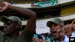 FILE—Supporters of former South African President Jacob Zuma hold a pro-Putin sign at Orlando stadium in the township of Soweto, Johannesburg, South Africa, for the launch of his newly formed uMkhonto weSizwe (MK) party's manifesto May 18, 2024.