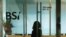An employee enters the reception area of Swiss bank BSI's office in Singapore, May 24, 2016.