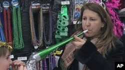 A woman shops for party supplies for New Year's Eve in a Virginia suburb of Washington, DC, Dec 30, 2010