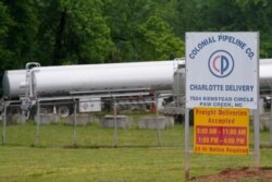 Tanker trucks are parked near the entrance of Colonial Pipeline Company on May 12, 2021, in Charlotte, N.C.