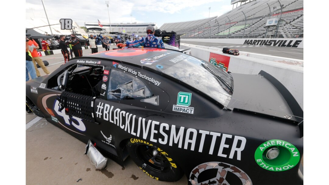 FILE - The car for driver Bubba Wallace has a Black Lives Matter logo as it is prepared for a NASCAR Cup Series auto race in Martinsville, Va., June 10, 2020.