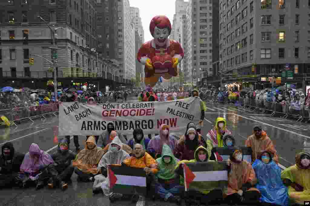 Pro-Palestinian protesters demonstrate on Sixth Avenue during the Macy's Thanksgiving Day Parade, Nov. 28, 2024, in New York.