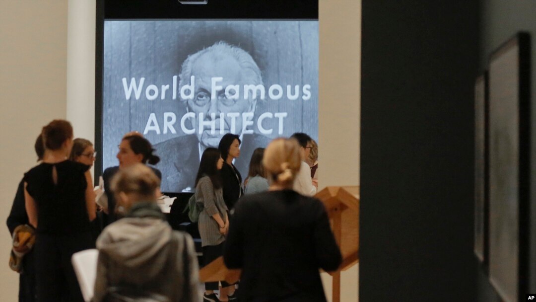 A video showing architect Frank Lloyd Wright as the mystery guest on the 1956 television show "What's My Line?", plays during a press preview for the MOMA exhibition "Frank Lloyd Wright at 150: Unpacking the Archive," June 8, 2017, in New York. 