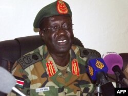 FILE - The Sudan People's Liberation Army (SPLA) Chief of Staff General James Hoth Mai speaks to the media in Juba, Jan. 2, 2014.