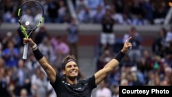 Reaksi Rafael Nadal saat mengalahkan Kevin Anderson dalam final tunggal putra turnamen AS Terbuka, Minggu (10/9).