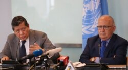 FILE - Marzuki Darusman, left, chair of the UN fact-finding mission on Myanmar gestures and Christopher Sidoti, right, an international human rights lawyer, listen during a press conference in Jakarta, Indonesia, Aug. 5, 2019.