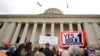 FILE - Supporters of Issue 1 attend a rally for the Right to Reproductive Freedom amendment held by Ohioans United for Reproductive Rights at the Ohio State House in Columbus, Ohio, Oct. 8, 2023. 