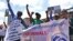 Environmental activists chant slogans as they carry placards and banners during a protest in Nairobi, Kenya, March 1, 2018, against a government decision to construct a standard-gauge railway line across the Nairobi National Park. 