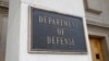 FILE - A photo shows a sign for the Department of Defense at the Pentagon building, in Arlington, Virginia, outside Washington, April 19, 2019. 