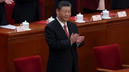 中共总书记习近平2024年3月11日参加中国全国人大闭幕会议。