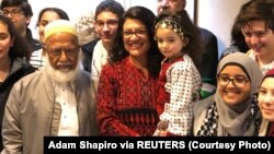 Congresswoman Rashida Tlaib poses with supporters outside her office at the Longworth House Office Building (LHOB), in Washington, D.C., Jan. 3, 2019 in this image obtained from social media. (Adam Shapiro via Reuters)
