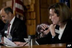 Georgia State Election Board member Janice Johnston makes a motion during discussion at a meeting at the state Capitol, Sept. 20, 2024, in Atlanta.