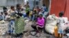 Displaced people sit near their belongings near a church where they are taking refuge, in Goma, North Kivu province, eastern Democratic Republic of Congo, Feb. 2, 2025.