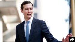 FILE - White House Adviser Jared Kushner waves as he arrives at the Office of the United States Trade Representative in Washington, Aug. 29, 2018.