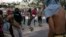 Demonstrators throw at police officers outside Mineirao stadium during Confederations Cup semifinal match between Brazil and Uruguay, Belo Horizonte, June 26, 2013.