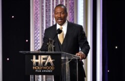 FILE - Eddie Murphy accepts the Hollywood career achievement award at the 20th annual Hollywood Film Awards at the Beverly Hilton Hotel in Beverly Hills, Calif., Nov. 6, 2016.