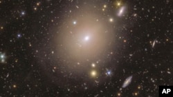 This photo provided by the European Space Agency shows a ring of light surrounding the center of the galaxy NGC 6505, captured by European Space Agency's Euclid telescope, an example of an Einstein ring. (European Space Agency via AP)