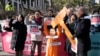 A protester wearing a mask of impeached South Korean President Yoon Suk Yeol attends with his fellow protesters during a rally calling for Yoon to step down in front of the Constitutional Court in Seoul, South Korea, Feb. 19, 2025. 