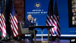 President-elect Joe Biden speaks during a meeting at The Queen theater Monday, Nov. 23, 2020, in Wilmington, Del. (AP Photo/Carolyn Kaster)