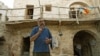 A July 2007 photo of Italian Father Paolo Dall'Oglio standing in a courtyard at the historic Monastery of Mar Moussa near a summit on the Qalamun massif,north of Damascus, Syria.