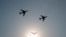 FILE - China's H-6 bomber jets fly in formation past the sun during a parade to commemorate the 70th anniversary of the founding of Communist China in Beijing, Oct. 1, 2019. 