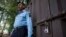 A Pakistani police officer stands guard outside a sealed Save the Children office in Islamabad, Pakistan, June 12, 2015. 