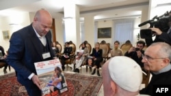 A photo made available by the Vatican Media shows Pope Francis (2ndR) meeting with family members of Israeli abducted by Hamas at the Vatican on November 22, 2023.