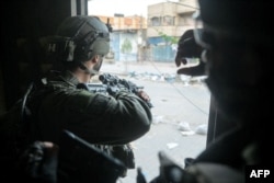 Tentara Israel beroperasi di Jalur Gaza di tengah konflik yang sedang berlangsung di wilayah Palestina antara Israel dan Hamas, 23 Juni 2024. (Foto oleh Tentara Israel / AFP)