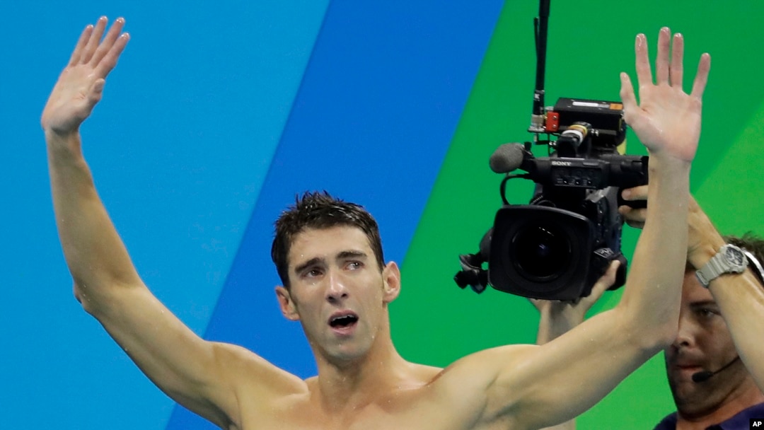United States Michael Phelps acknowledges the crowd after his team won in the 2016 Summer Olympics.