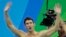 United States Michael Phelps acknowledges the crowd after his team won in the 2016 Summer Olympics.