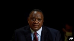 FILE - Kenya's President Uhuru Kenyatta attends a tech conference in Paris, Oct. 1, 2020.