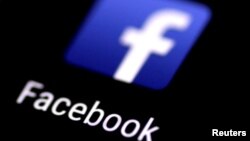 FILE: The Facebook application is seen on a phone screen.