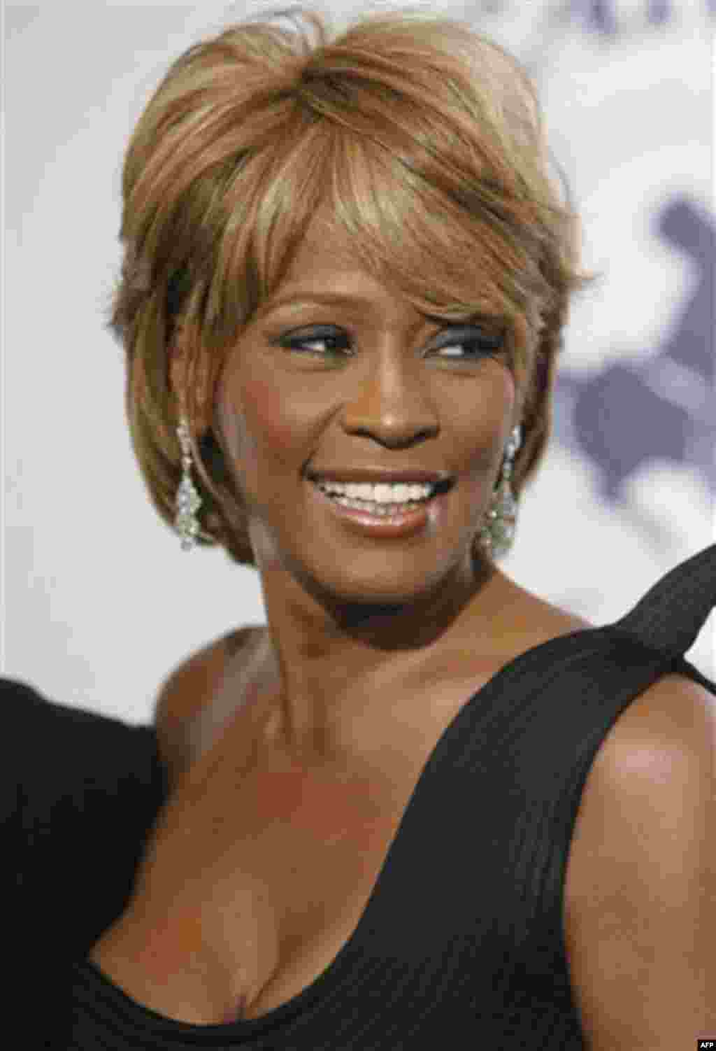 File- In this Oct. 28, 2006, file photo, musician Whitney Houston arrives at the 17th Carousel of Hope Ball benefiting the Barbara Davis Center for Childhood Diabetes in Beverly Hills, Calif. Houston died Saturday, Feb. 11, 2012, she was 48. (AP Photo/Mat