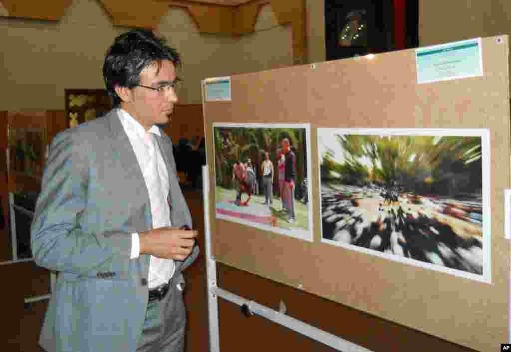A six picture combo shows from top left to bottom right : AFP reporter Sammy Ketz, take cover as a Syrian soldier runs past during sniper fire in Syria's ancient Christian town of Maalula, scene of recent fighting between pro-government troops and rebel forces.
