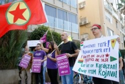 FILE - Israelis demonstrate against the Turkish military offensive in northeastern Syria, Oct, 17, 2019, in front of the Turkish embassy in the Israeli coastal city of Tel Aviv.