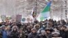 In this photo taken on Feb. 3, 2019, protesters rally against plans by authorities to accept trash from Moscow, in Arkhangelsk, Russia. Protesters have rallied in more than a dozen Russian cities and towns against waste management plans.