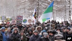 In this photo taken on Feb. 3, 2019, protesters rally against plans by authorities to accept trash from Moscow, in Arkhangelsk, Russia. Protesters have rallied in more than a dozen Russian cities and towns against waste management plans.