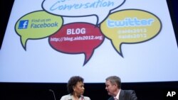 Rep. Barbara Lee, D-Calif., left talks with former Senate Majority Leader Bill Frist before a session at the XIX International AIDS Conference in Washington, July 25, 2012.