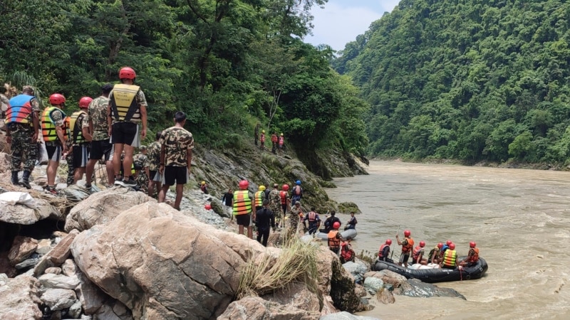Rescuers recover first body from 2 buses hit by landslide in Nepal