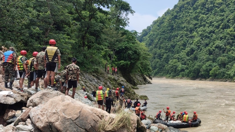 Nepal rescuers recover 11 bodies after landslide swept 2 buses into river